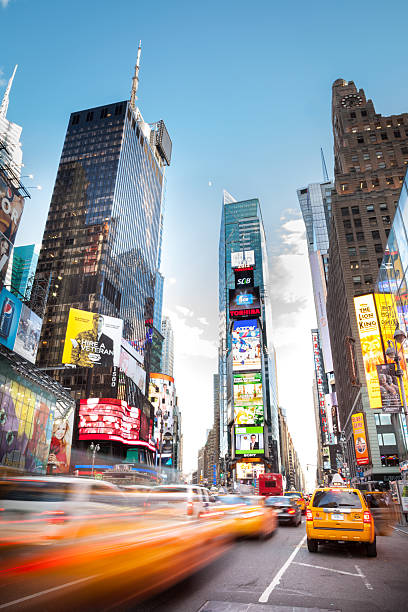 7th Avenue NYC Cars and taxis bustling in Manhattan, New York City in the Times Square area. times square manhattan stock pictures, royalty-free photos & images