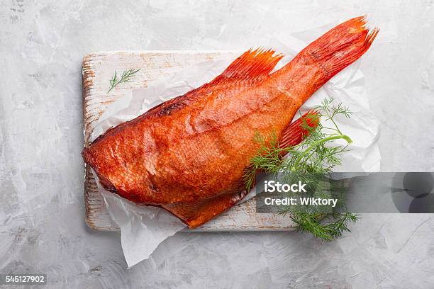 Delicious Smoked Fish On Wooden Background Stock Photo - Download Image Now