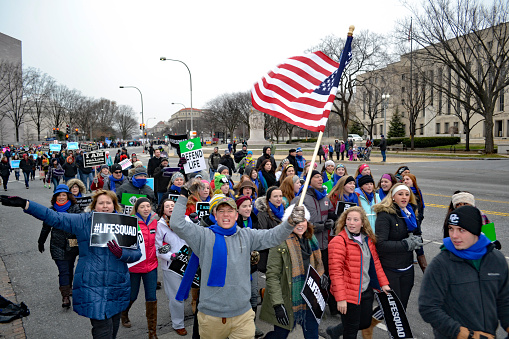 Washington, D.C., USA - January 22, 2016: Pro Life marchers start towards the U.S. Supreme Court in their annual March For Life.