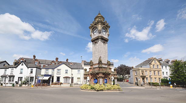 The Clock Tower The Clock Tower in Exeter, Devon erected by Mrs Louisa A Miles in 1897 as a fountain for horses exeter england stock pictures, royalty-free photos & images
