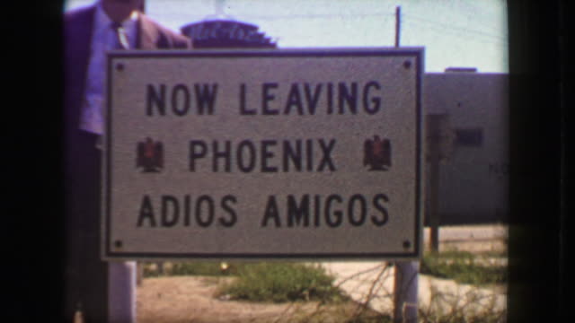 1949: Now leaving Phoenix adios amigos roadside travel tourist sign.