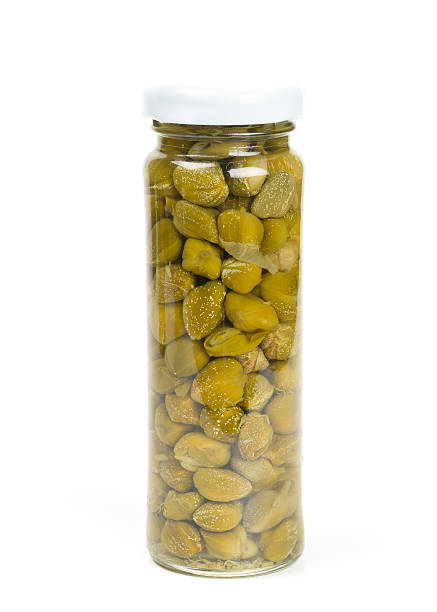 istock capers in a glass jar isolated on white 545240488
