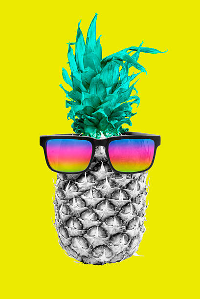 istock Colorful summer pineapple fruit with sunglasses 545241854