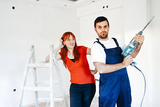 istock Young couple makes repairs in home together. 545242056