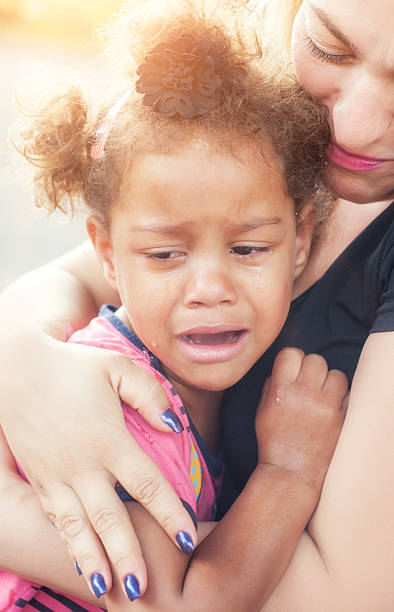 istock Mother comforting her crying little girl 545243206