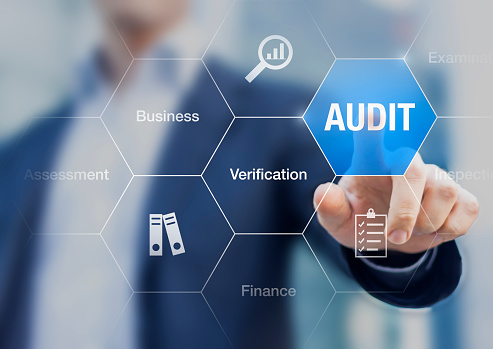 Concept about financial audit to verify the quality of accounting in businesses with auditor in background