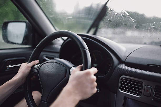 istock Drive car in rain. Hands on steering wheel 545246014