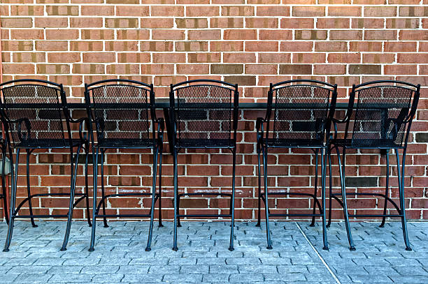 istock Outdoor Restaurant Chairs at Brick Wall 545246658