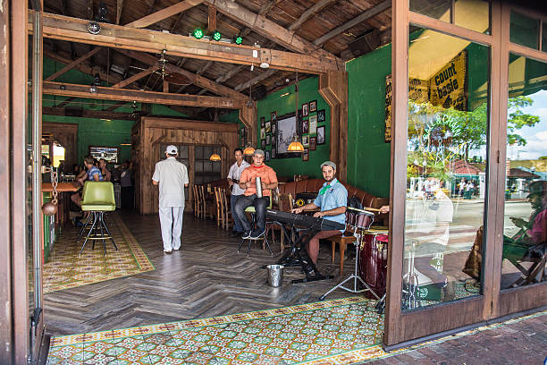Miami, Florida, USA - April 25, 2016:  View of musicians at a bar along Calle Ocho in Little Havana, Miami.   Little Havana is home to many Cuban immigrants and is a notable tourist stop known for its Cuban entertainment. 