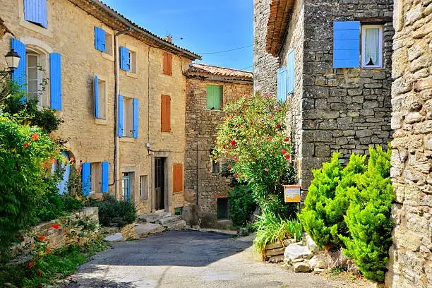 Pretty houses with colorful shuttered windows in a quaint village in Provence, France
