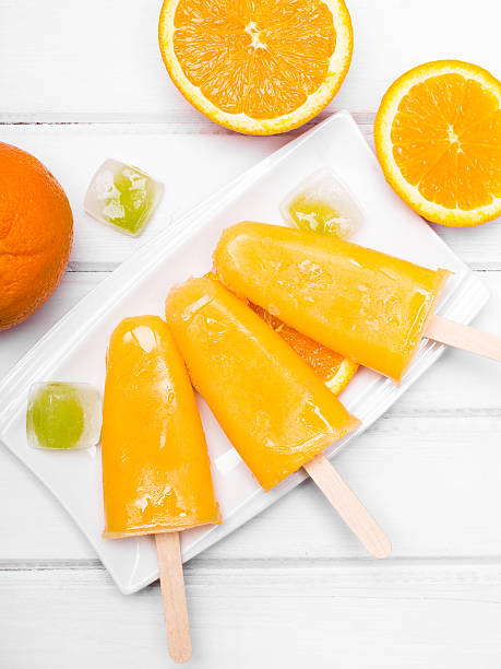istock Homemade orange ice cream on a stick 545251262