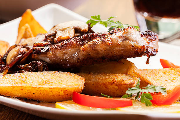istock Fried pork chop with mushrooms and chips 545253510