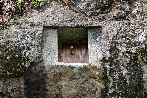 Traditional cave grave carved in the rock.  Lemo is cliffs old burial site in Tana Toraja.  South Sulawesi, Indonesia