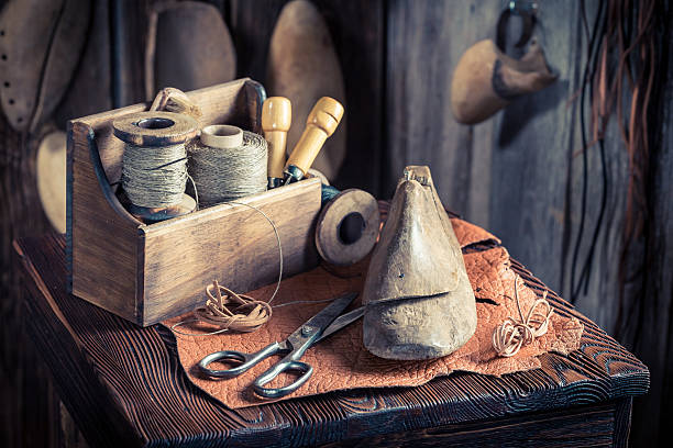 istock Shoemakers workplace with tools and materials for shoes 545258008