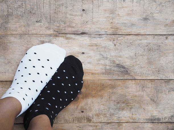 istock feet wearing black and white polka dot socks 545258028