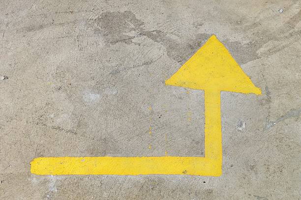 istock yellow arrow sign on the road 545258566