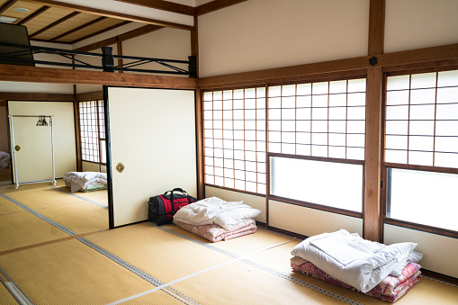 View of guesthouse bedroom near Monks leaving quarters at Chion-ji temple in Kyoto, Japan. It is traditional way with sleeping on tatami. In day time the bad is nicely placed.