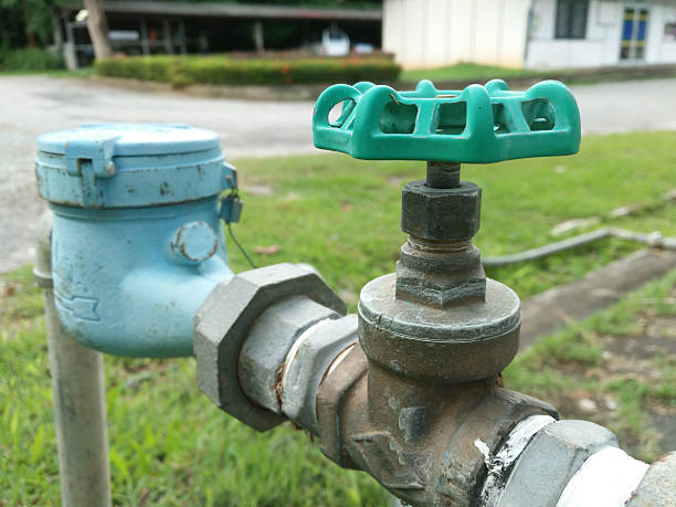 istock Old water valve of brass mounted connect with water meter 545263120