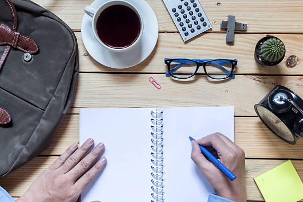 istock Office supplies and coffee cup on  wooden table 545263248