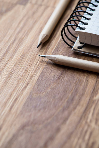 istock Notebook and pencil on a wooden table 545263914