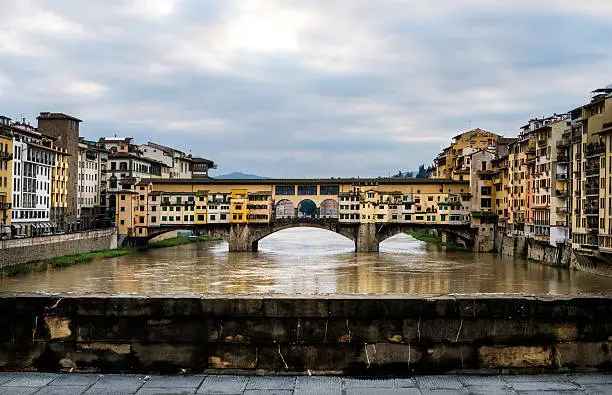 Photo of Perspective view of Old Ponte Vecchio Bridge on dull day