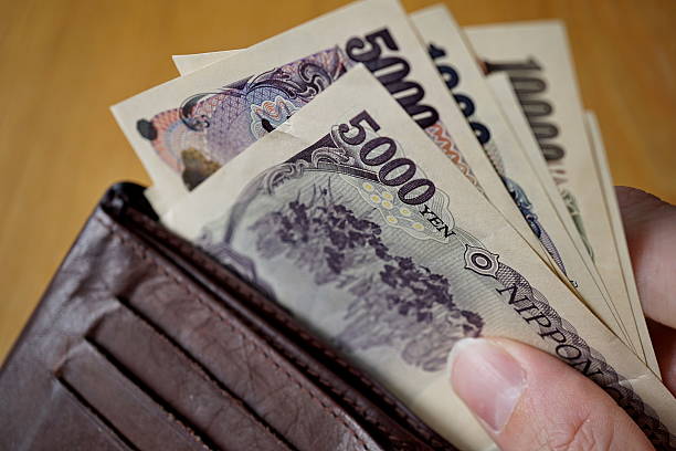 istock Japanese currency (yen)  on the wooden background 545269300