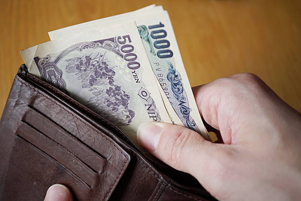 istock Japanese currency (yen)  on the wooden background 545269416