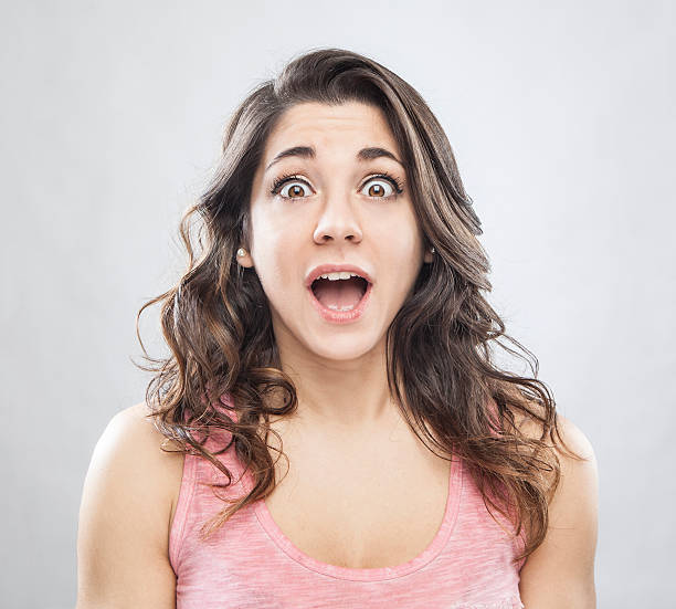 istock young beautiful woman with a surprised face expression 545270882