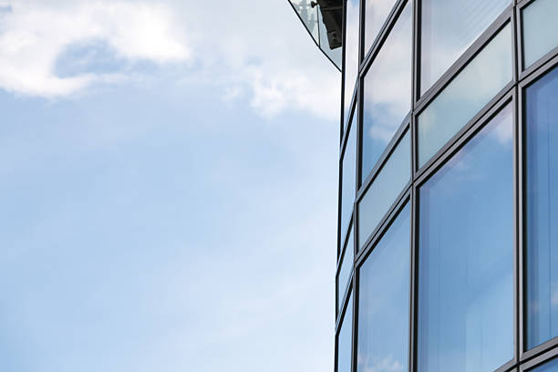 istock Business abstract - modern office building covered with glass. 545271128