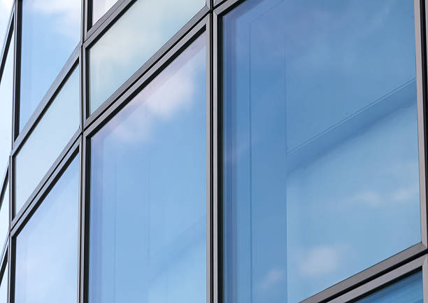 istock Business abstract - modern office building covered with glass. 545271234