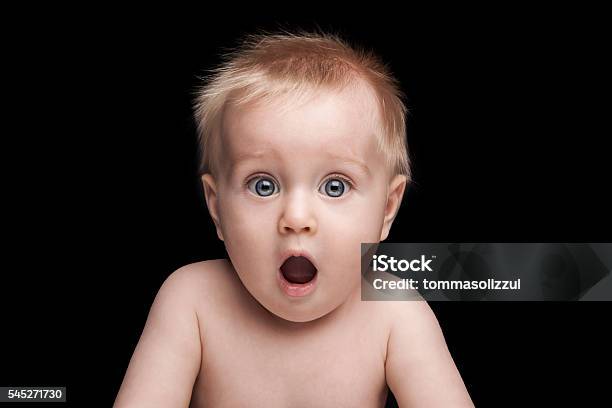Newborn Baby Portrait With Funny Shocked Face Expression Stock Photo - Download Image Now