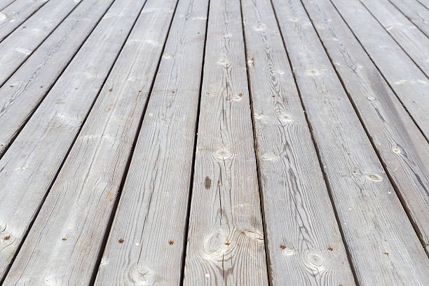 istock Gray wooden textured pier with pins. Horizontal. 545271978