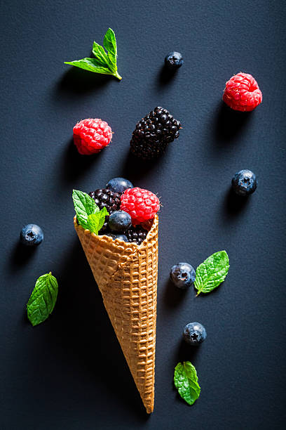 istock Ice cream with berry fruits in cone as a concept 545273740