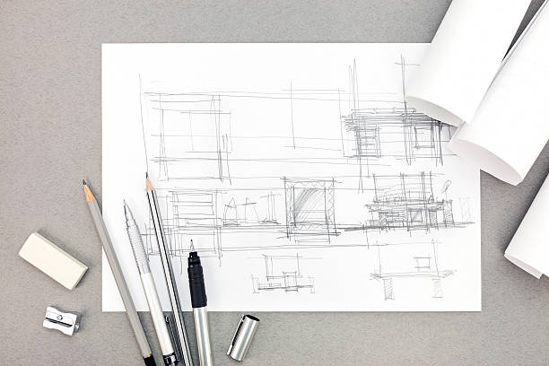istock interior hand drawing concept with paper rolls and pencils 545277062