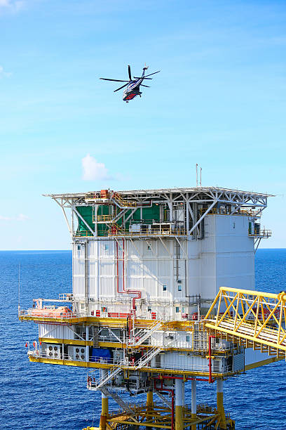 istock helicopter parking landing on offshore platform, Helicopter transfer crews 545277116