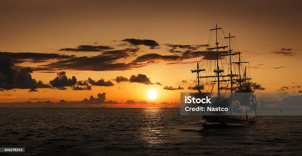 Pirate ship silhouette Silhouette of a pirate ship at the open sea with copy space Tall Ship Stock Photo