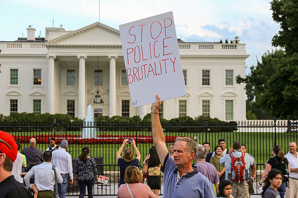DC 'March on the White to End Police Brutality' Washington, D.c., United States - July 7, 2016: Protestors gather in front of the White House after recent police involved shootings of Alton Sterling and Philando Castile police brutality photos stock pictures, royalty-free photos & images