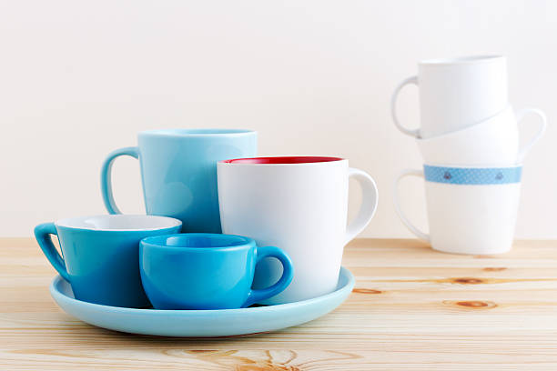 istock Blue cups and white mug on wood table 545279122