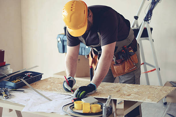 istock Male carpenter in working clothes in a construction workshop 545279330