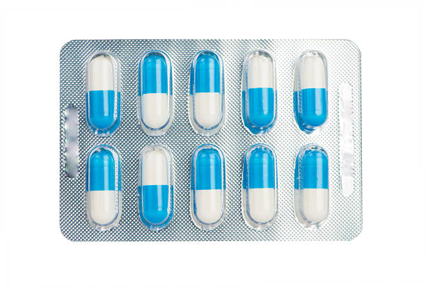 istock Blue and white capsule in blister pack show medicine concept 545280872