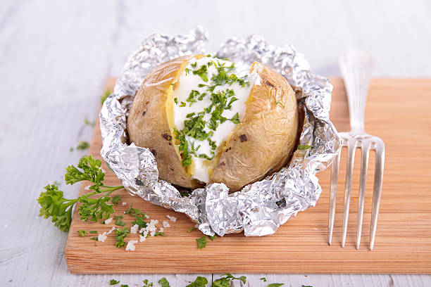 istock baked potato with chives 545280904