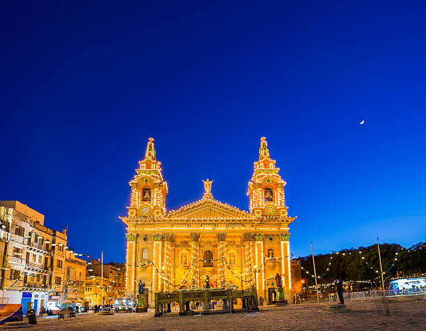 istock Malta, Valletta - St.Publius church Easter lights by night 545282022