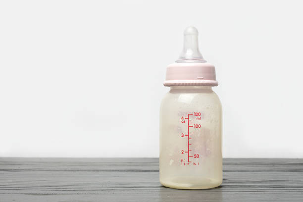 istock Baby Bottle on wooden 545282088