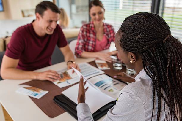 istock Financial advisor discussing with couple 545284060