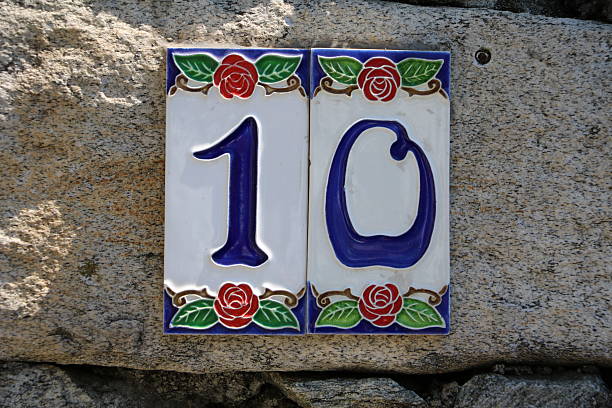 istock house number ten at a stone wall 545284624