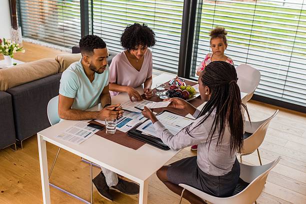 istock Financial advisor giving brochure to her clients 545284754