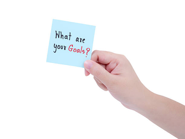 istock Single woman hold What are your goals on notepad 1 545284794