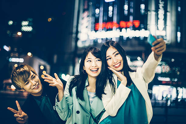 istock Friends making selfie on street at night 545285360