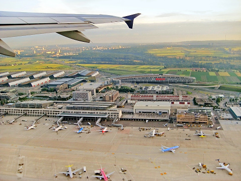 Stuttgart, Germany - June 21, 2008: Stuttgart Airport - aerial view. Terminals with airplanes in parking position in front during take off.