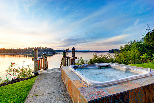 istock Awesome water view with hot tub at dusk 545334978